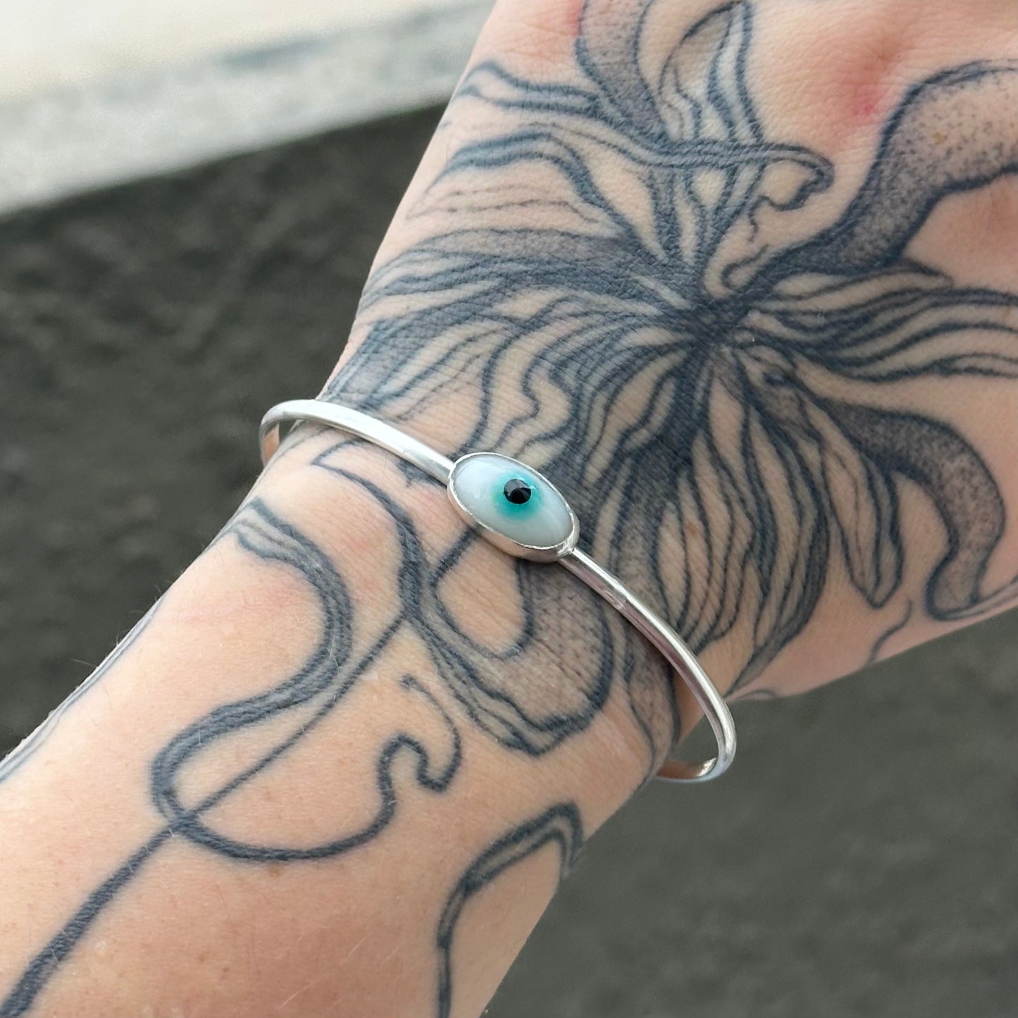 seeing eye cuff